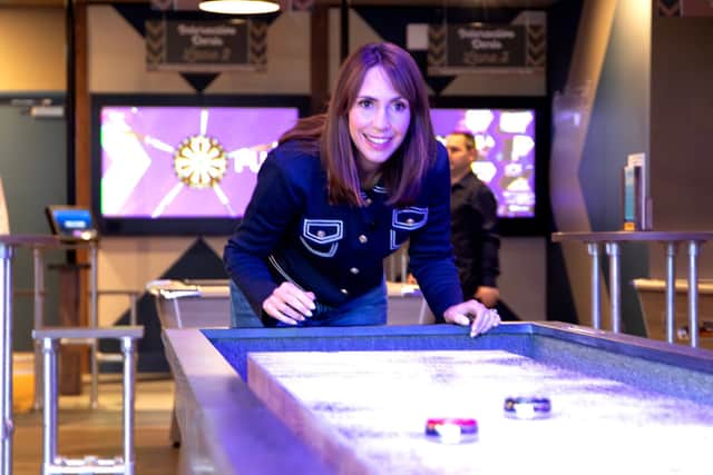 The new Sports Cafe at Unity Beach has shuffleboard, and Alex Jones gave it a try.