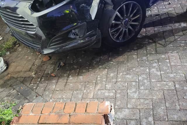Car smashes through wall and into house's front garden in Dudley ...