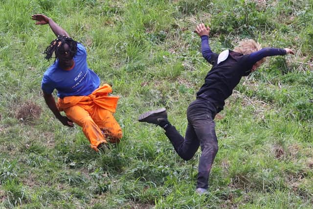 Contestants take part the annual Cheese Rolling Race at Coopers Hill in Brockworth, Gloucestershire this Bank Holiday Monday. May 26 2025.