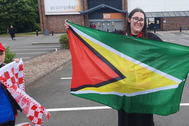 Alex Hopton shows her support for Leon Gordon with the Guyanese flag