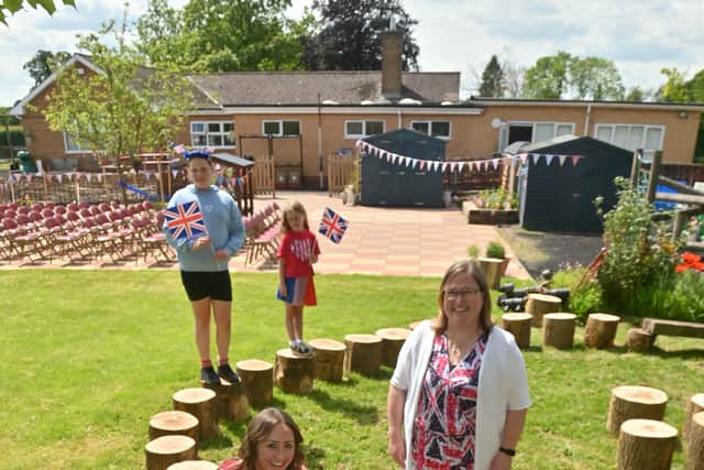 Corbett Primary School, where they have had a special day of events marking the official opening of there new garden. At the front is: Esme 7, Edward 8, Mid: Lucy Timmins with dog Rufus, Harley-Bear 8, Head: Emma Jones, back: Chloe 11 and Nancy 7.