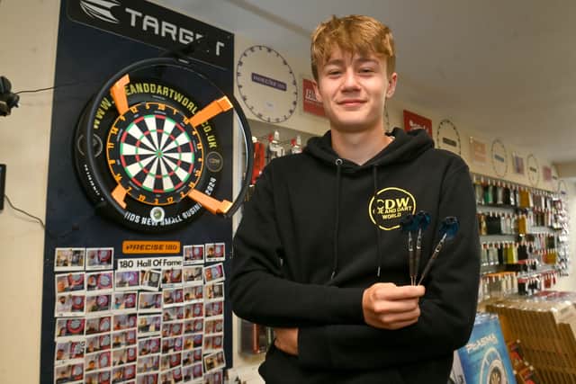 Cue and Darts World is one of the most unique businesses in Codsall. Pictured is staff member Ollie Wordley. Photo: Steve Leath
