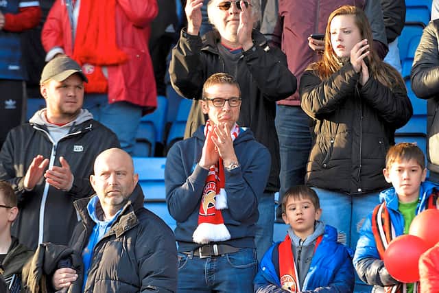 Walsall fans applaud their team despite relegation from League One in 2019.