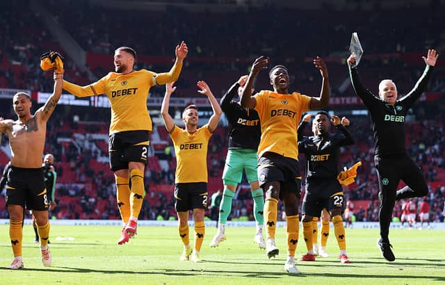 Matt Doherty and Marshall Munetsi of Wolverhampton Wanderers celebrate victory with team mates Joao Gomes, Pablo Sarabia and Nelson Semedo after defeating Manchester United 0-1 (Photo by Wolverhampton Wanderers FC/Wolves via Getty Images)