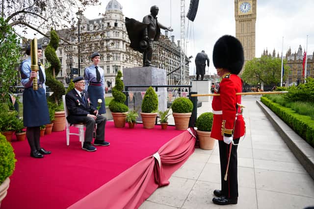 Mr Alan Kennett spoke with a member of the Band of the Irish Guards near Paliament Square in Central London. Credit: Jeff Moore/PA Wire