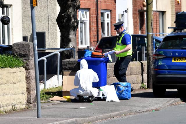 Forensic investigators could be seen at the scene
