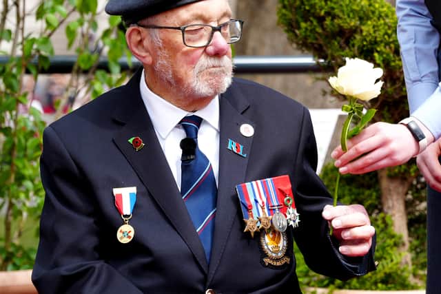 Mr Kennett received a peace rose near Parliament Square, central London, ahead of a military procession marking the 80th anniversary of VE Day, Credit: Jeff Moore/PA Wire