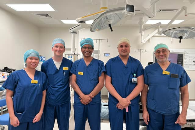 (Pictured centre) Consultant urologists Mr Fahd Khan and Mr Ananda Dhanasekaran with other members of the team who deliver HoLEP surgery