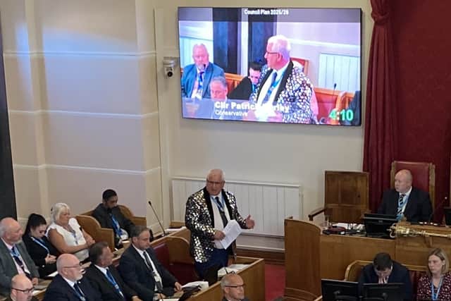 Cllr Patrick Harley on his feet during a full council meeting in April wearing a jacket he won in an auction at the mayor\'s ball. Picture Martyn Smith/LDRS free for LDRS use
