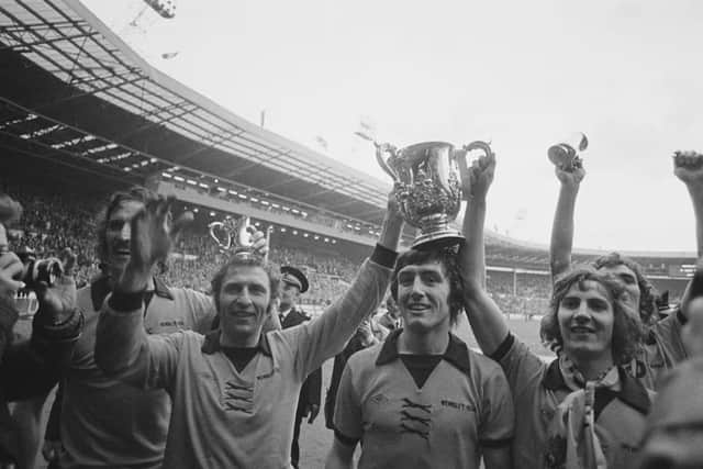 Wolverhampton Wanderers players with the trophy after beating Manchester City in the Football League Cup Final at Wembley Stadium, London, 23rd February 1974. Left to right: Derek Dougan, Mike Bailey (captain), John Richards and Gary Pierce. Wolves won the match 2-1 . (Photo by Blackbrow/Daily Express/Hulton Archive/Getty Images)