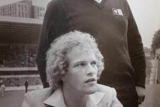 Andy Gray signing on the dotted line after Wolves broke the British transfer record to sign him from Aston Villa.