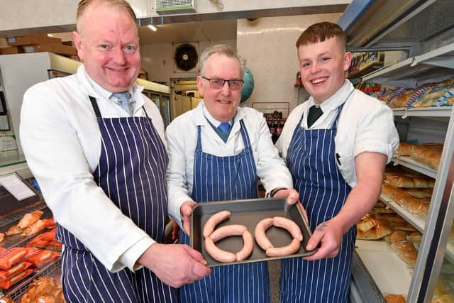 Ken Wood (centre) is celebrating being a butcher at Butchers and Freezer Centre, Cannock, for sixty years. He is pictured with son Kevin and grandson Louie.