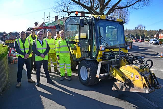 . Sandwell Council has a new machine called Multihog, which it says speeds up the time preparing the roads for repairing potholes. Pictured is Councillor Keith Allen with the team.