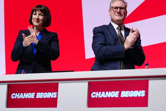 Rachel Reeves and Sir Keir Starmer applaud while on stage at the Labour Party conference in Liverpool.