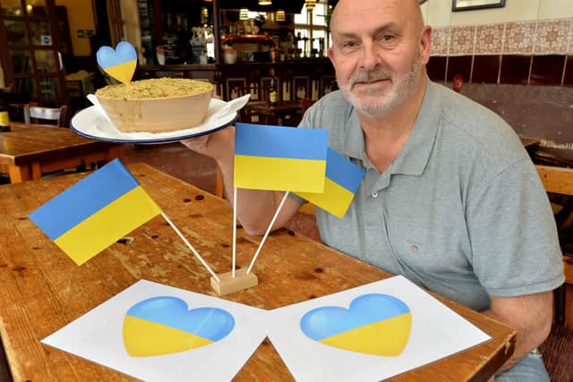 Pete Towler shows off the Chicken Kyiv pie, one of many of the creative pies made at Mad O'Rourke's
