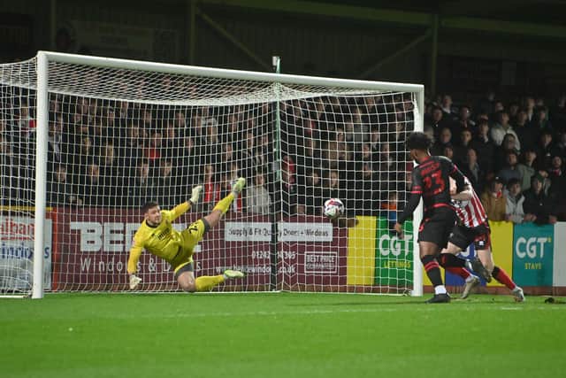 Walsall striker Ellis Harrison opens the scoring inside the first 60 seconds.