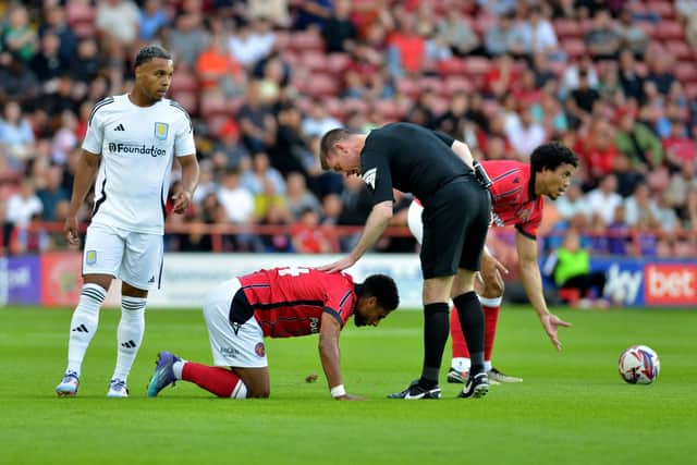 Walsall midfielder Brandon Comley fractured his leg during a 3-0 defeat against Villa in pre-season.