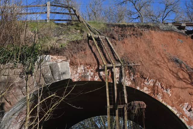 The landslide on the Severn Valley Railway, near to the Astbury Gold Course and Bridgnorth. Half of the edging stones on a bridge have gone aswel as the land. On some pics is local worker: Alex Stevens, he saw the landslide and was the one that called it in to the railway.