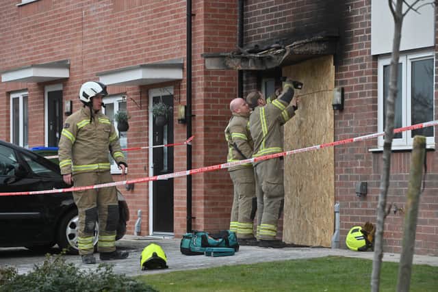 Fire crews appeared to be boarding off the front door to the home on Friday morning