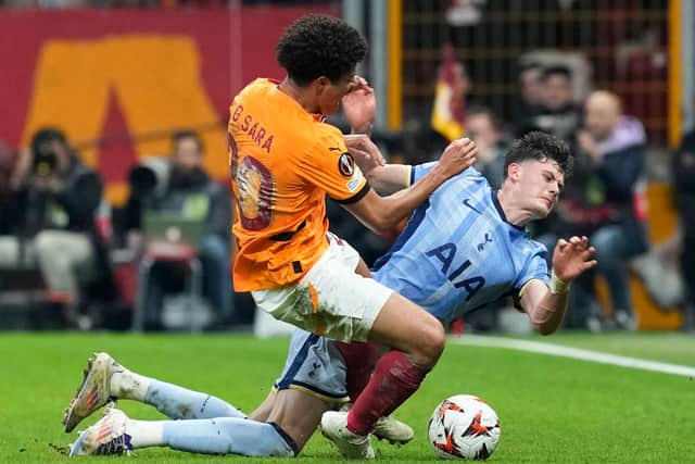 Tottenham’s Will Lankshear, right, challenges for the ball (Khalil Hamra/AP)