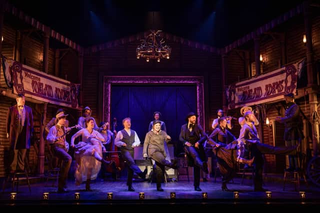 The cast of "Calamity Jane" in full flight.