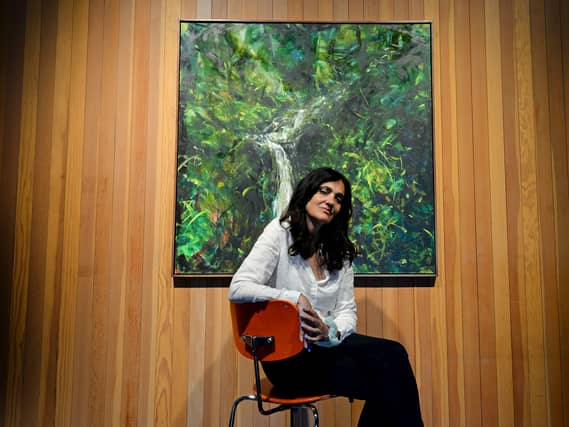 Cleo David with her mother Yasmin David's artwork at the New Art Gallery, Walsall