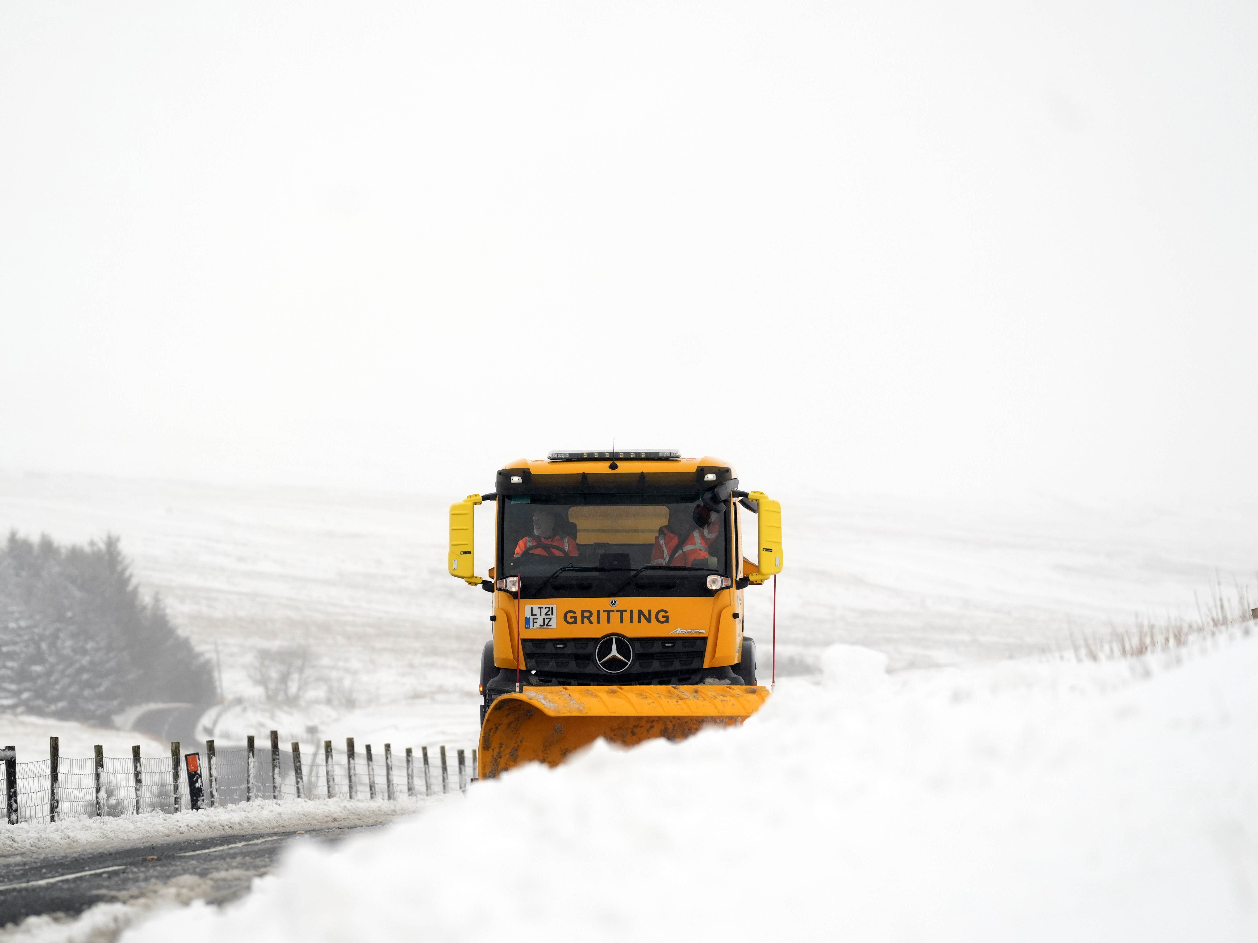In Pictures: Floods and heavy snow as winter arrives with a vengeance