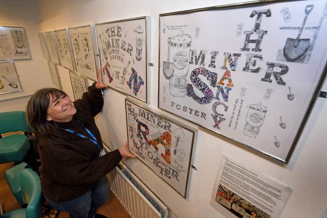 Course leader Clair Harris looks at some of the artwork which will be on display