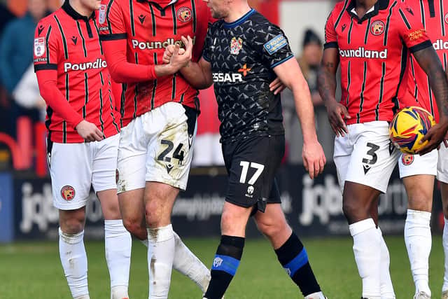 Sam Finley makes his way off the pitch after getting a red.