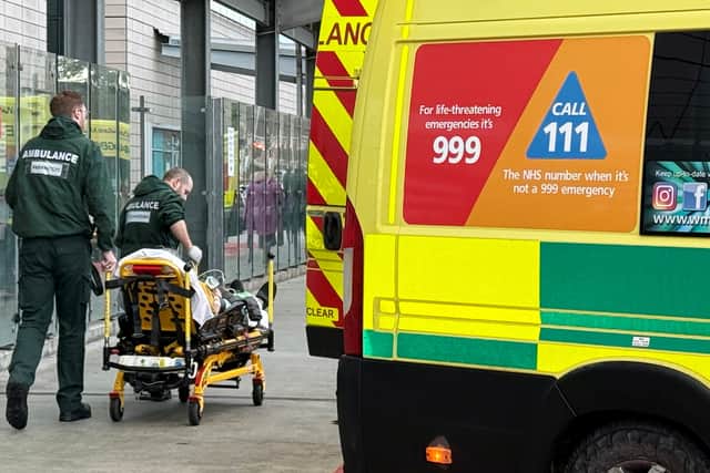 A row of ambulances parked outside Queen Elizabeth Hospital, Birmingham, on January 7, 2025. 