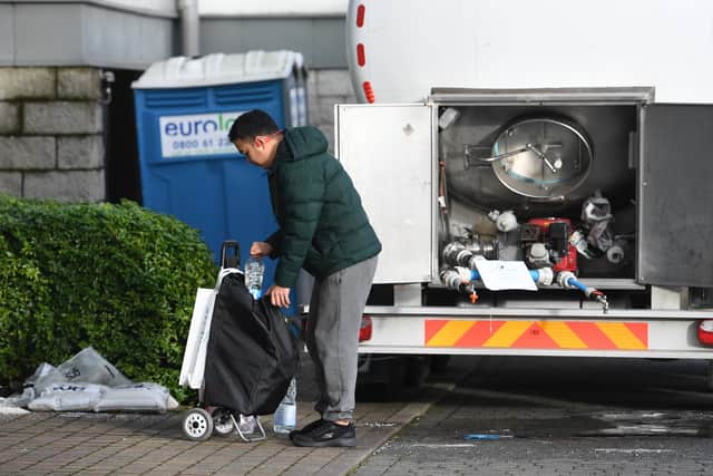 Residents need to visit the water bowsers to refill their bottles