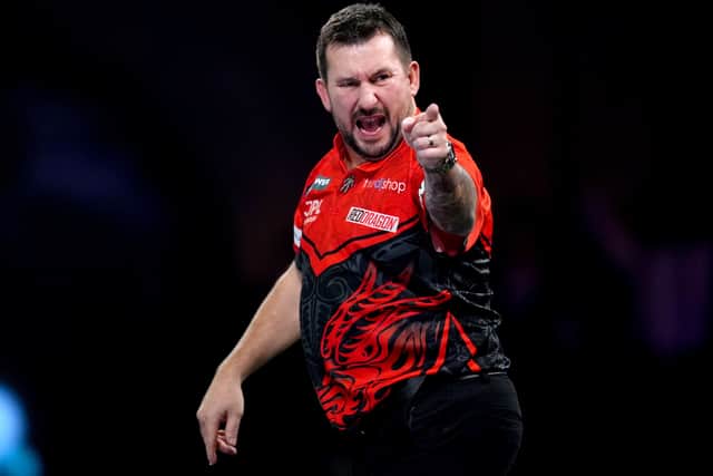 Jonny Clayton dug in to book his place in round three at Alexandra Palace (John Walton/PA)