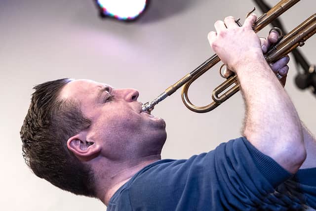 Big Band leader Nick Dewhurst soloing on trumpet