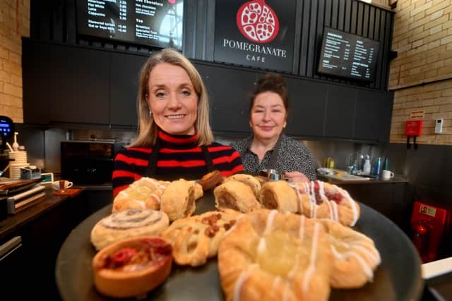Lucie Tait-Harris and Teresa Chumber display a number of the cakes and bakes available from Pomegranate Cafe