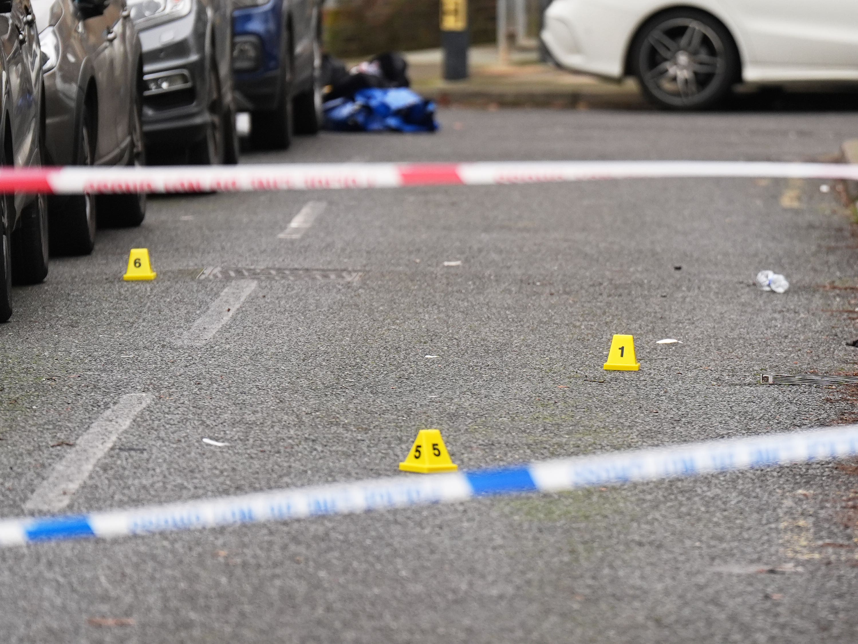 Woman killed in shooting which left two men injured