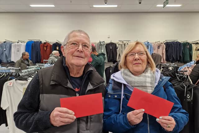 Locals Diane and Robert were looking for perfume and aftershave with their free vouchers.