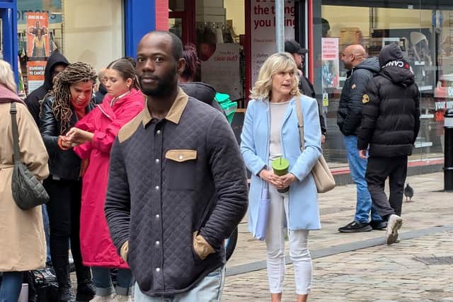 Cast members could be seen preparing for their next scene on Queen Street