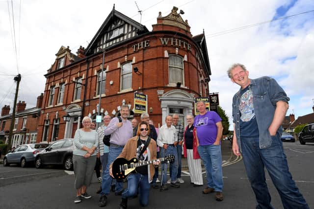 Mark Webster, front, and fellow members of Friends of The White Lion pub
