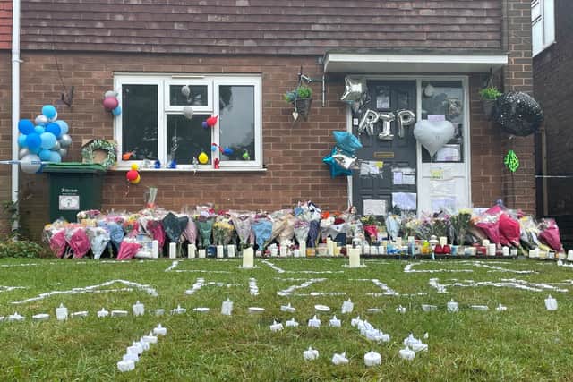 Tributes left outside the house where Jahziah Coke was stabbed to death. Photo: Matthew Cooper/PA Wire.