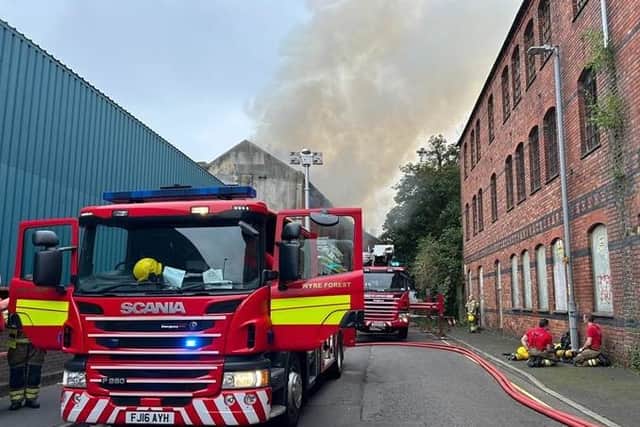 Flames seen shooting from windows as fire crews battle blaze in ...