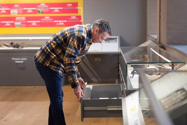 A visitor looking at an exhibit at Coalbrookdale Museum of Iron. Photo: Ironbridge Gorge Museum Trust