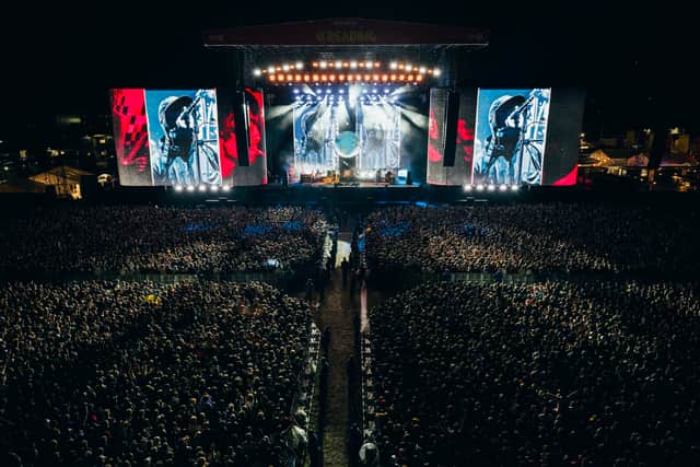 Liam Gallagher performing on stage at the Reading Festival