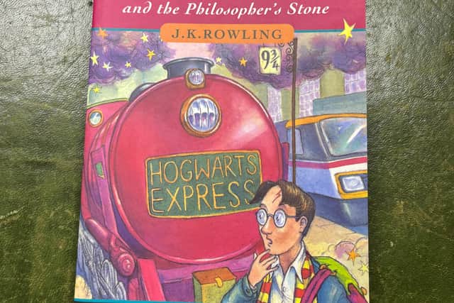 On the back cover of the first edition, an o is missing from the word Philosopher’s.