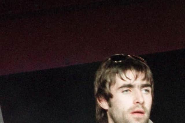 Oasis lead singer Liam Gallagher (left) and his brother Noel