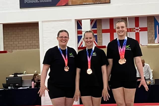 Proud members of the team with their medals. Photo: Freedom Leisure