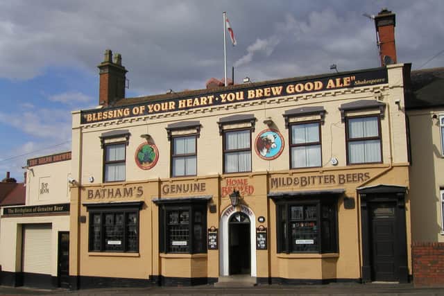 The Vine is described as an unspoilt brewery tap with an ornately decorated facade