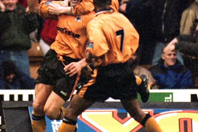Havard Flo celebrates with Wolverhampton teammates after equalising against Arsenal