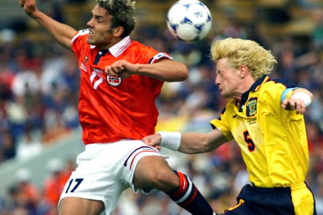 Colin Hendry of Scotland, right, and Havard Flo of Norway struggle for the ball