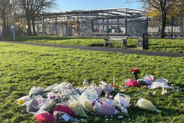 Floral tributes left at the scene in at Stowlawn playing fields in Wolverhampton where Shawn Seesahai died on Monday November 13. Two 12-year-old boys charged with murder and possessing a machete have appeared before Wolverhampton Crown Court and been remanded into youth detention until next year. Picture date: Monday November 20, 2023. PA Photo. See PA story COURTS Wolverhampton. Photo credit should read: Matthew Cooper/PA Wire.