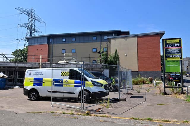 Police are still on the scene at Eagle House in Newport Road, Stafford after the death of a young woman on Monday